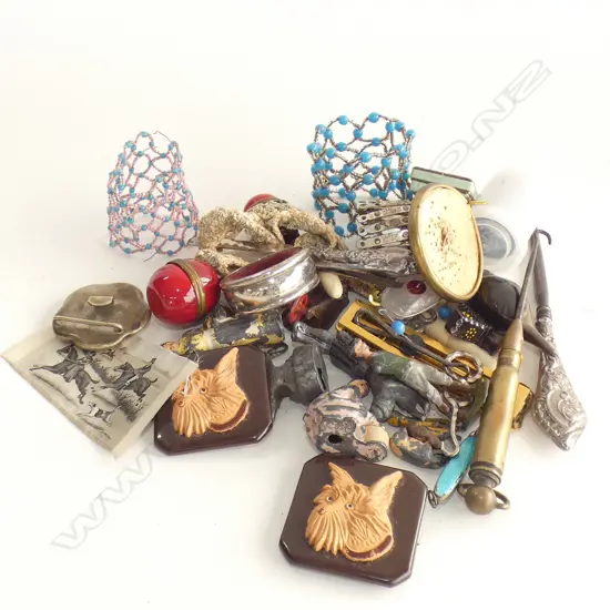 Assorted items; tin toy figures, belt buckles, needle box items, button hooks etc.